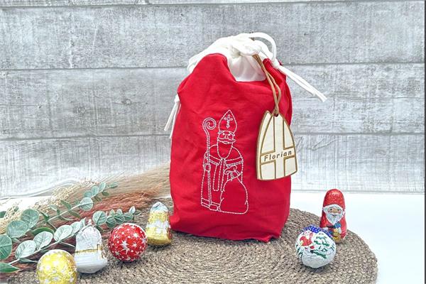 Nikolaussackerl aus Baumwolle | bestickt mit einem Nikolaus | personalisiert mit Namensanhänger